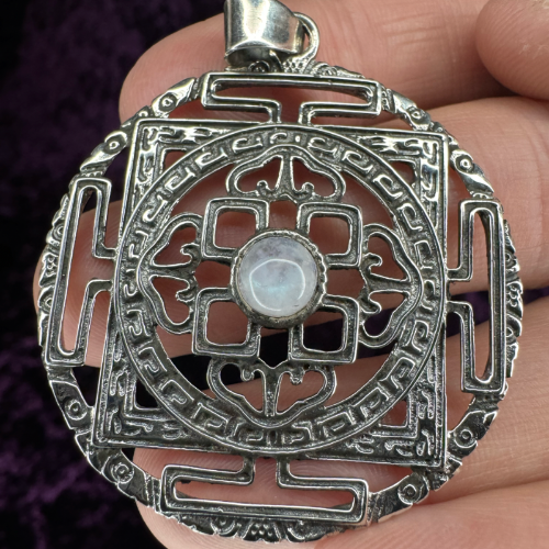 Sri Yantra Mandala Sterling Silver Pendant with Moonstone Closeup on Hand