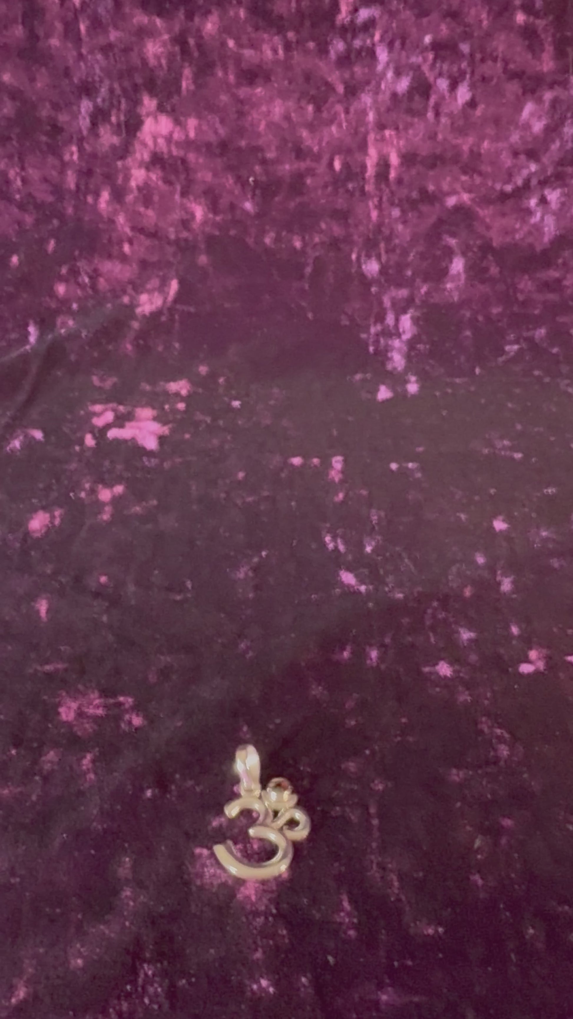 OM Symbol Sterling Silver Pendant with Garnet up close