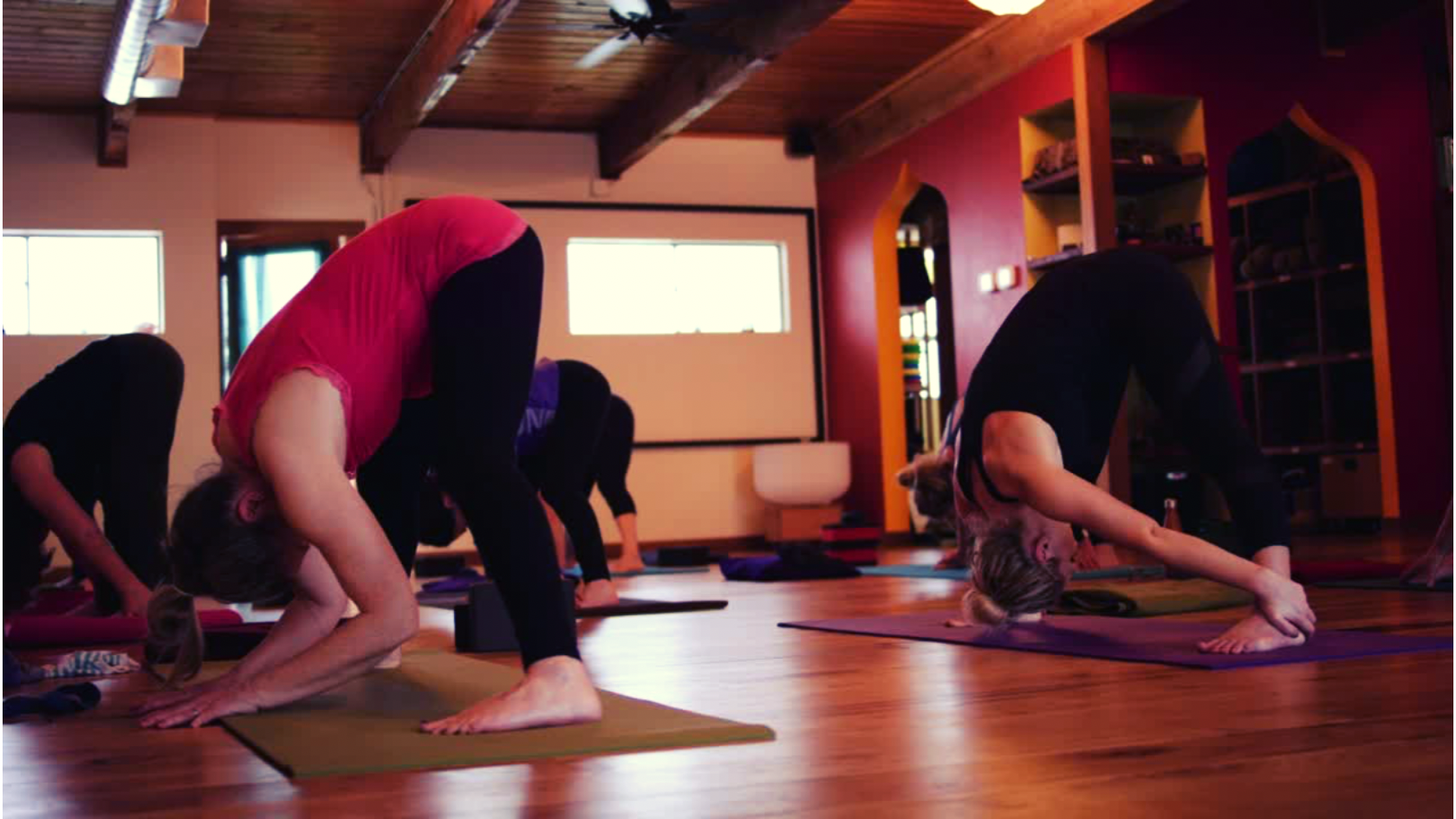 Yoga Students in yoga studio yoga class using asivana mats and props