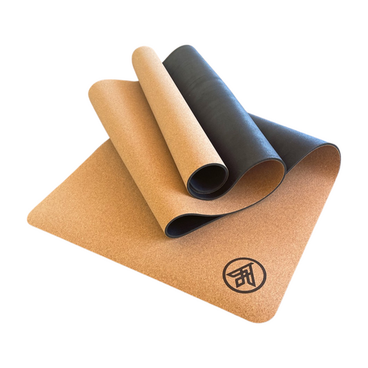 The Flux cork yoga mat cork top with logo and natural rubber bottom folded up