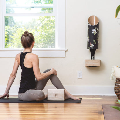 Dogwood Yoga Mat Tube On Wall with Yoga Practitioner