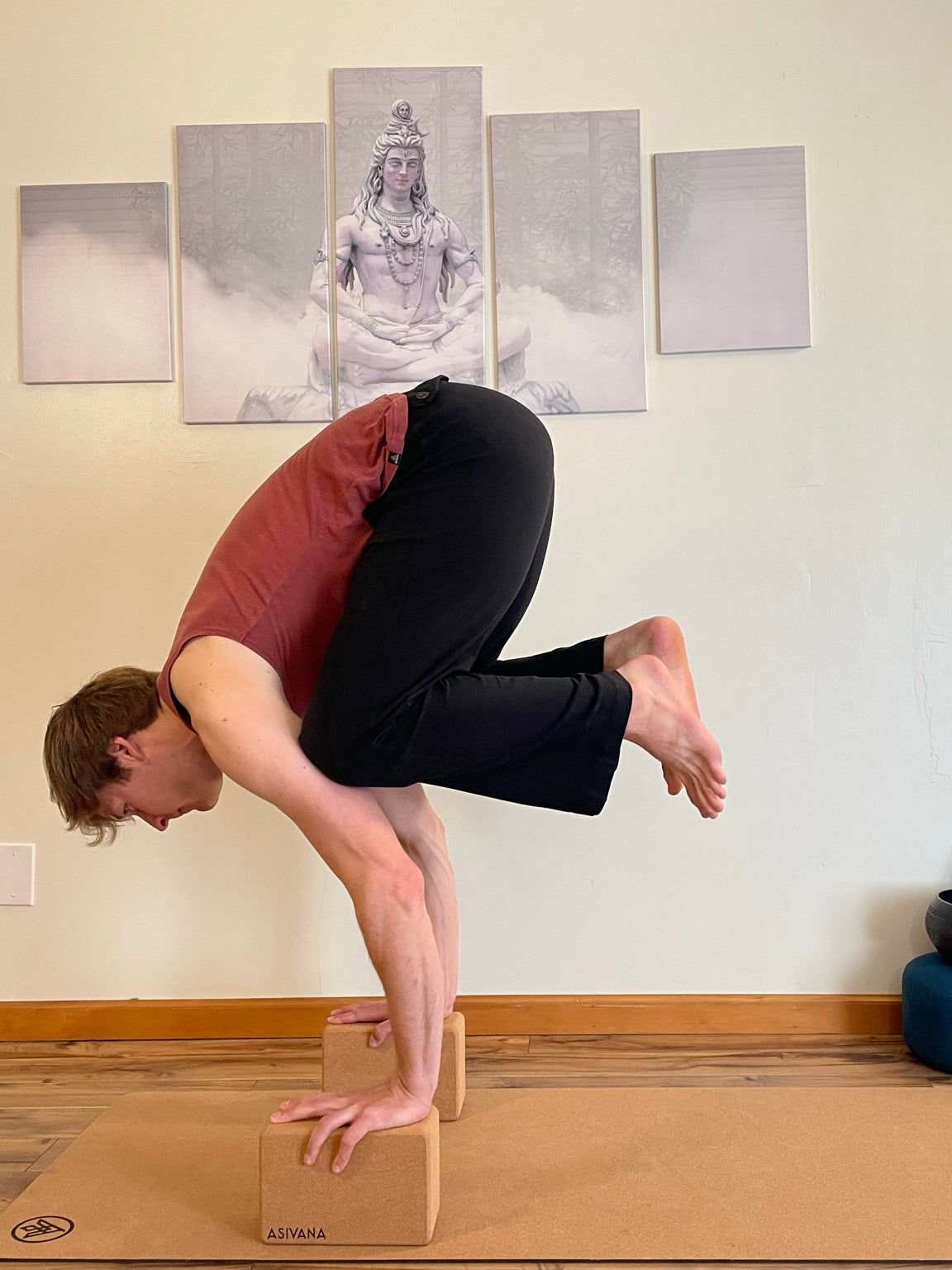 EcoBlock Cork Yoga Block being used to support arm balance crow pose