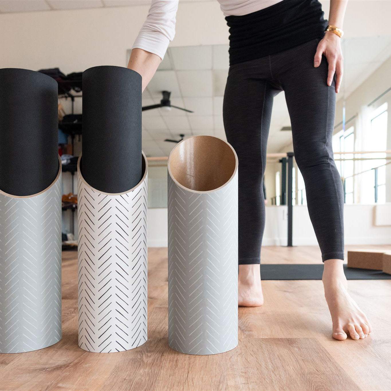 Hatch Yoga Mat Tubes In Use in a Yoga Studio