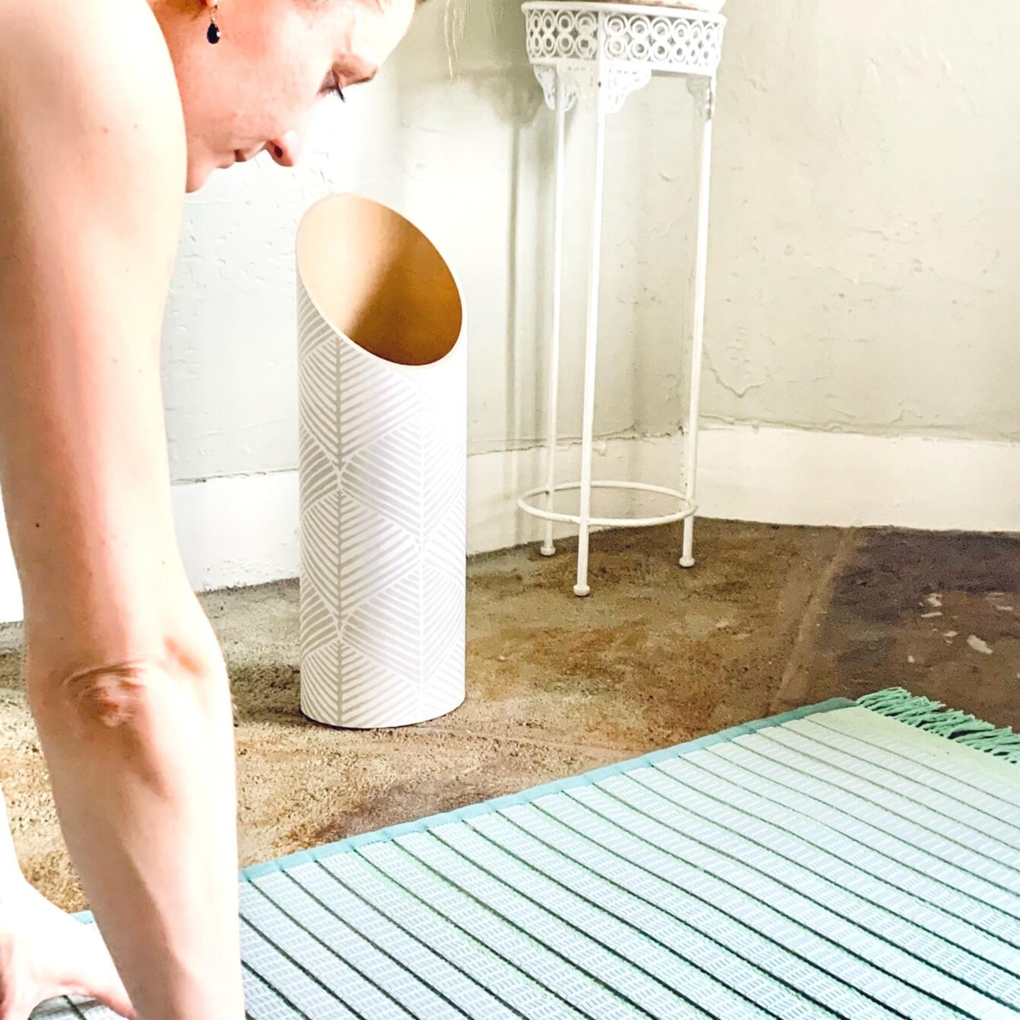 Leaf Out Yoga Mat Tube White in Use by Yoga Practitioner