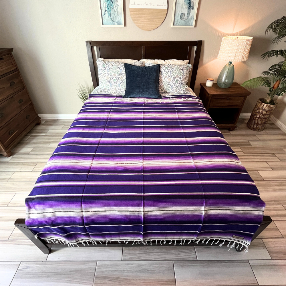 Purple Isla Serape Yoga Blanket Laid Across Bed
