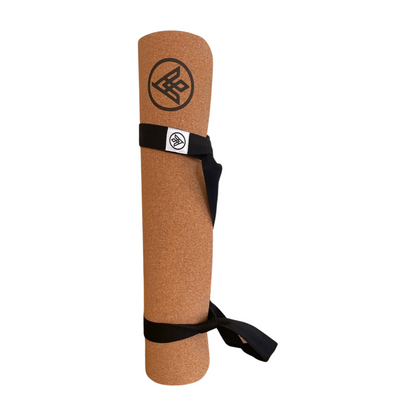 The Simple Yoga Mat Carrying Strap Looped around a Flux Cork Yoga Mat by Asivana