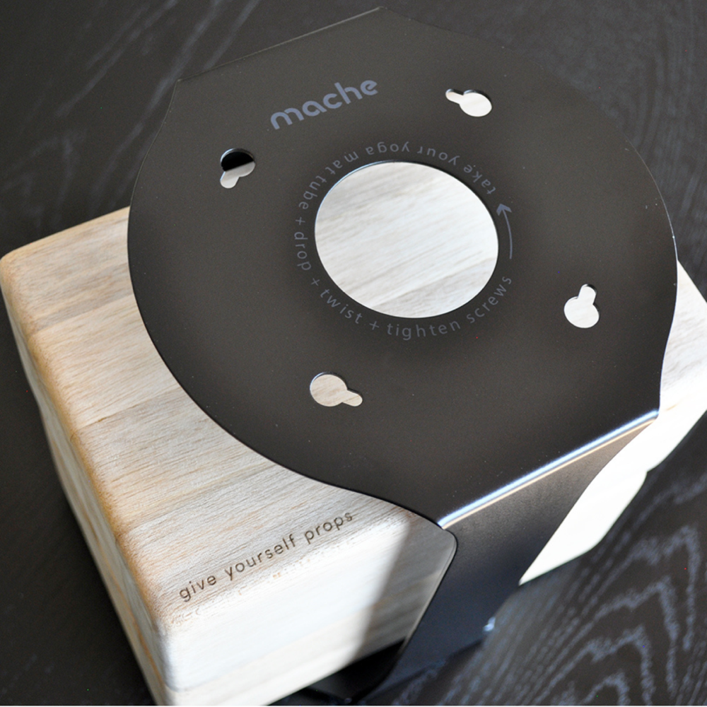 Close-up of the Black Homi yoga block floor stand