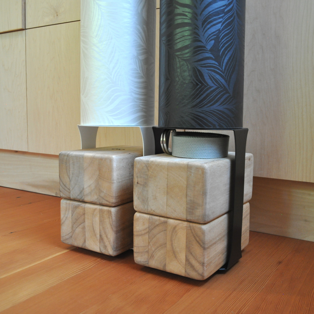 Front view of the Black Homi yoga block floor stand