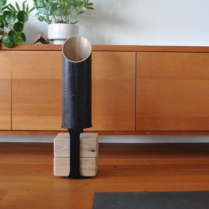 Black Homi yoga block floor stand in a home yoga space