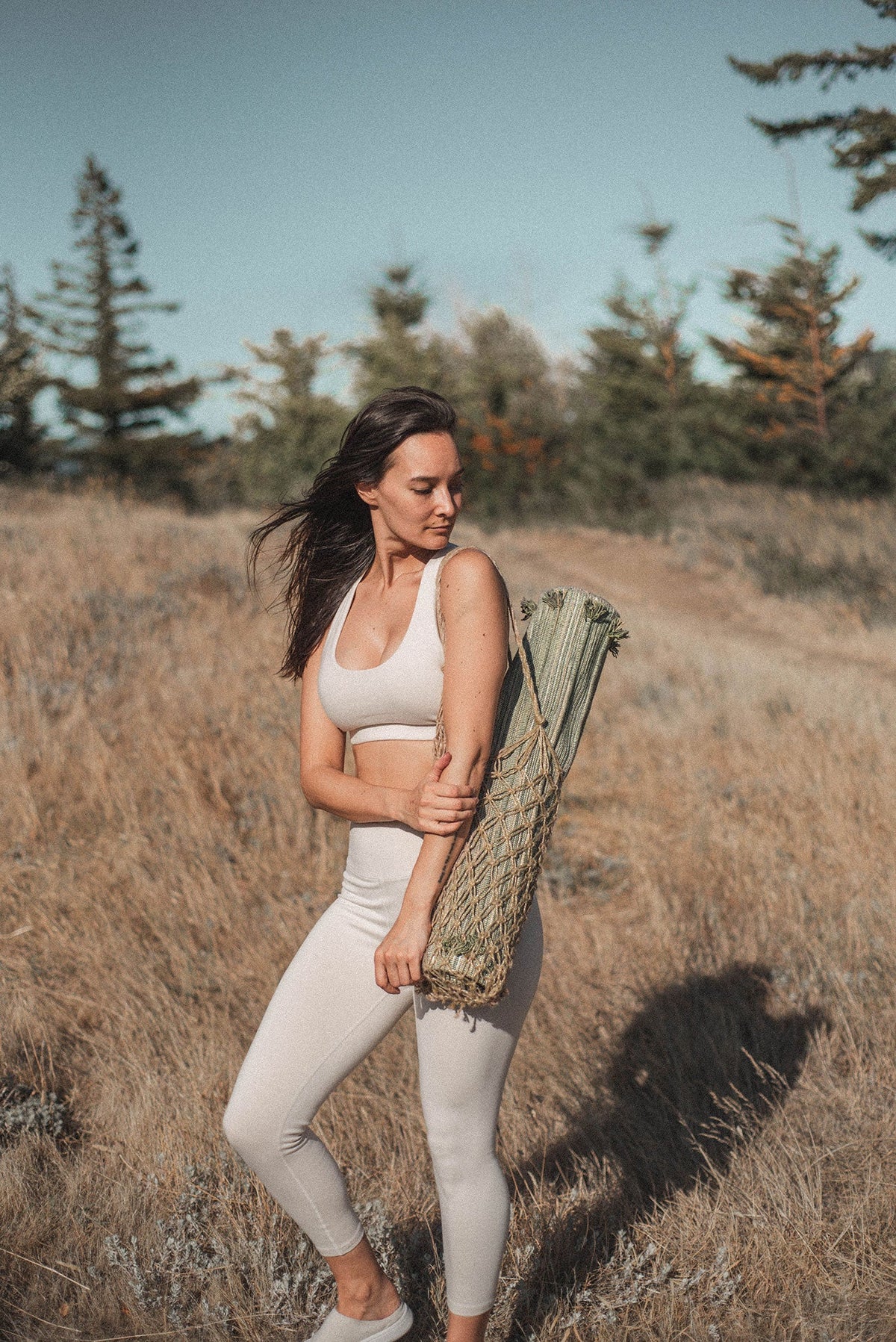 Jade and Jute herbal cotton yoga mat being carried