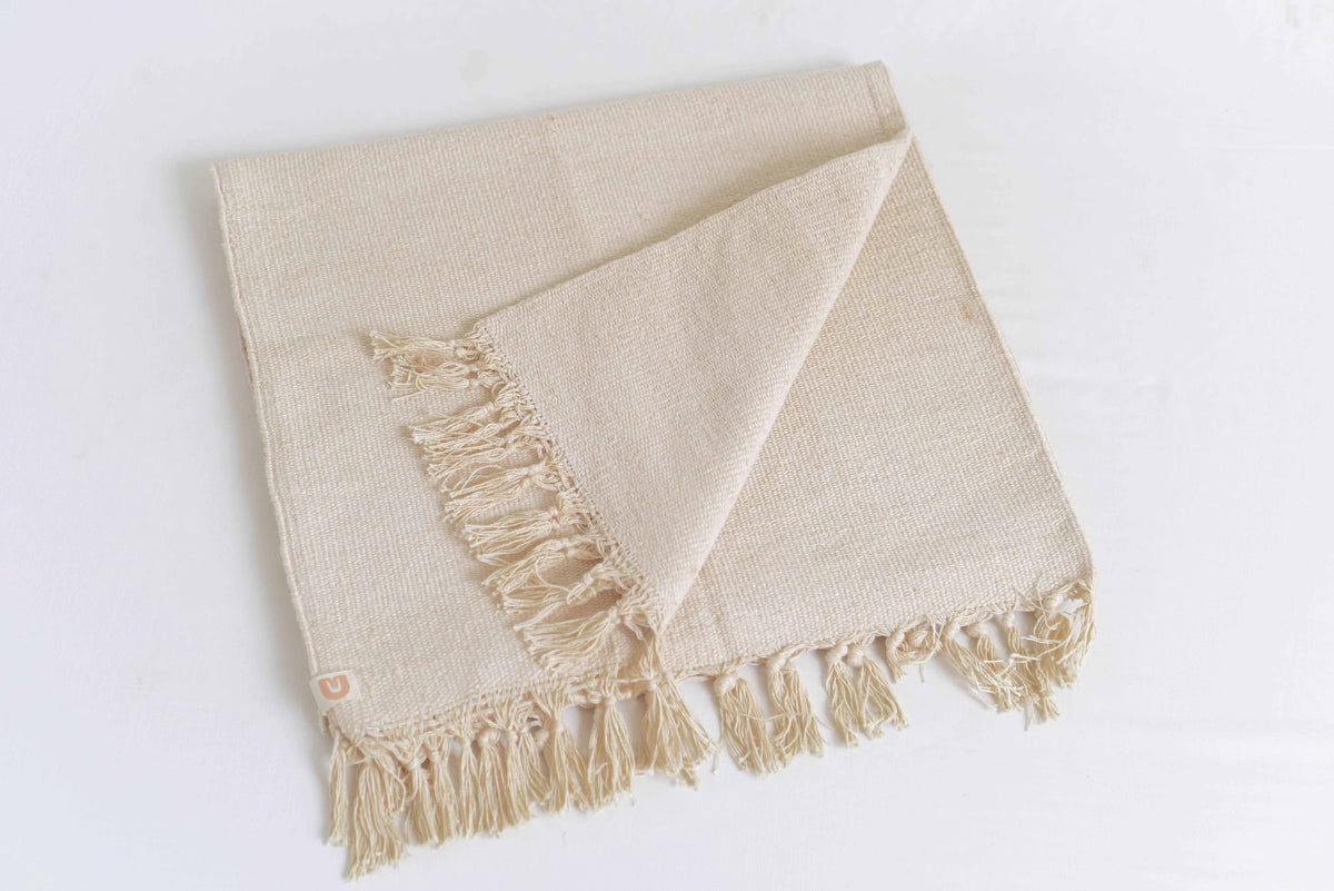 Cream naturally dyed organic cotton yoga blanket folded