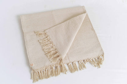 Cream naturally dyed organic cotton yoga blanket folded