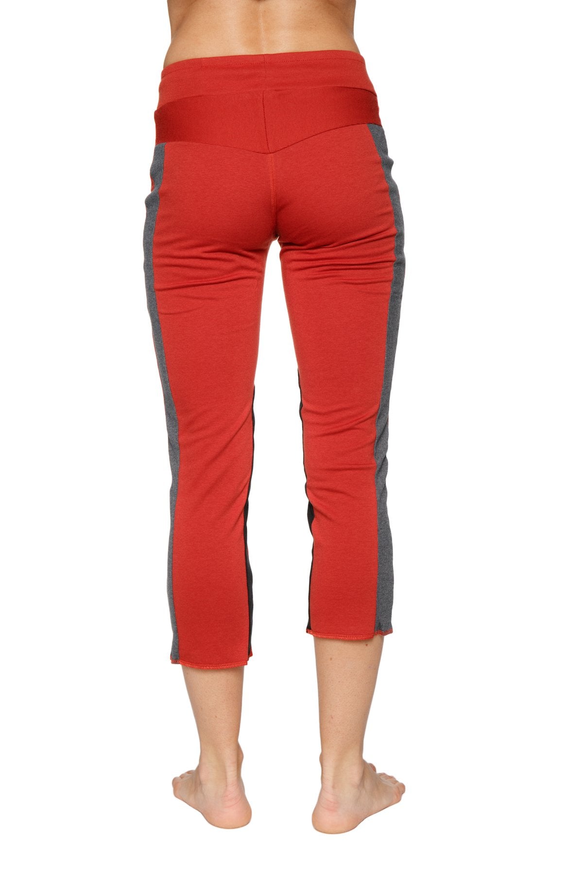 Back view of Women's 4/5 capri yoga pants in Cinnabar Red