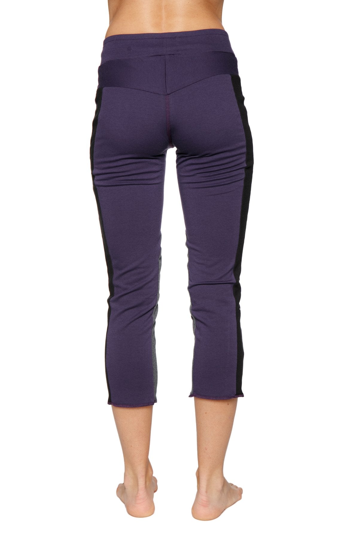Back view of Women's 4/5 capri yoga pants in Eggplant Purple