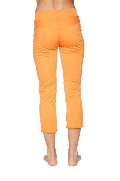Back view of Women's 4/5 capri yoga pants in Sun Orange